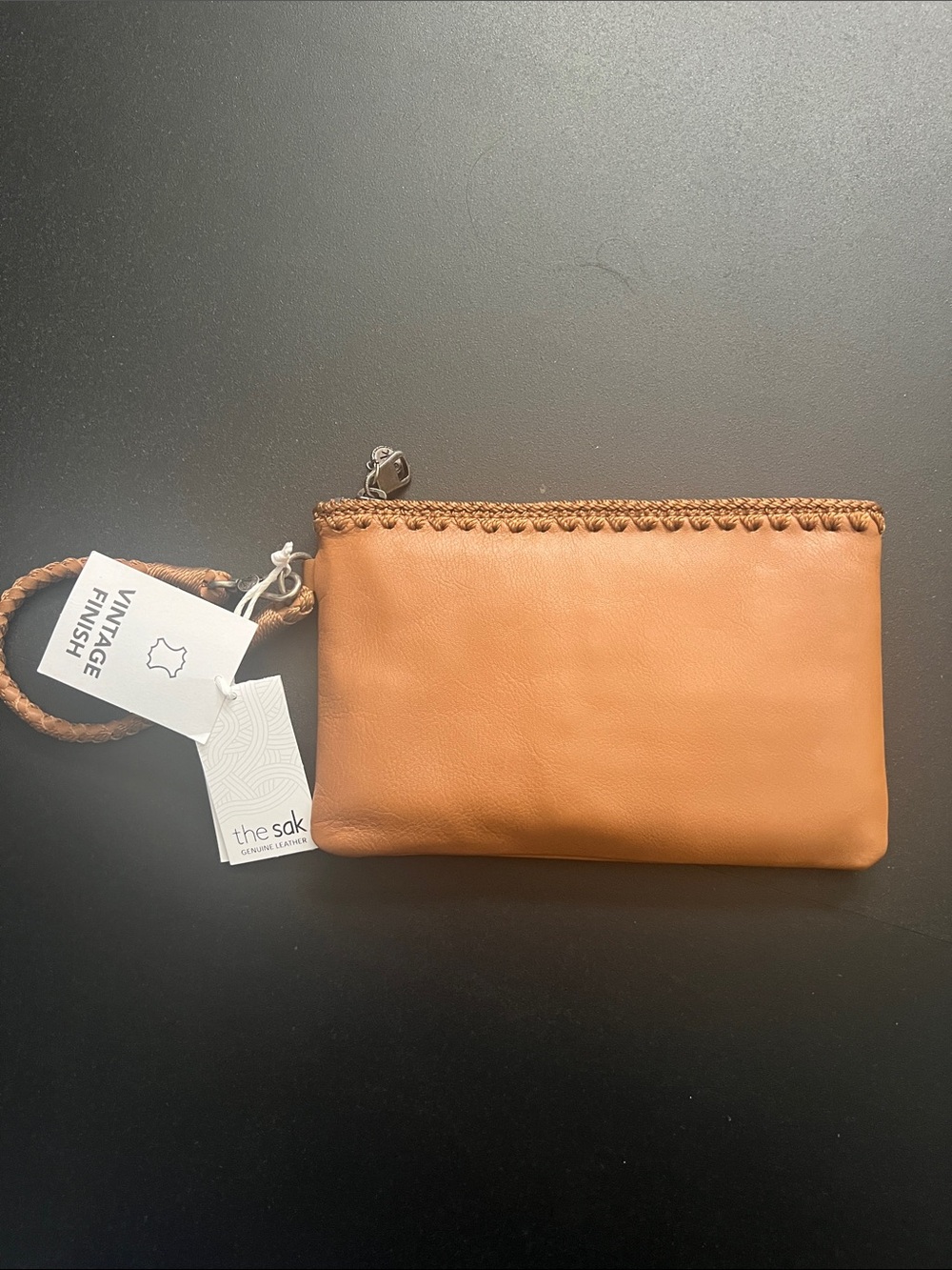 The Sak tan Leather Wristlet Clutch with Braided Trim